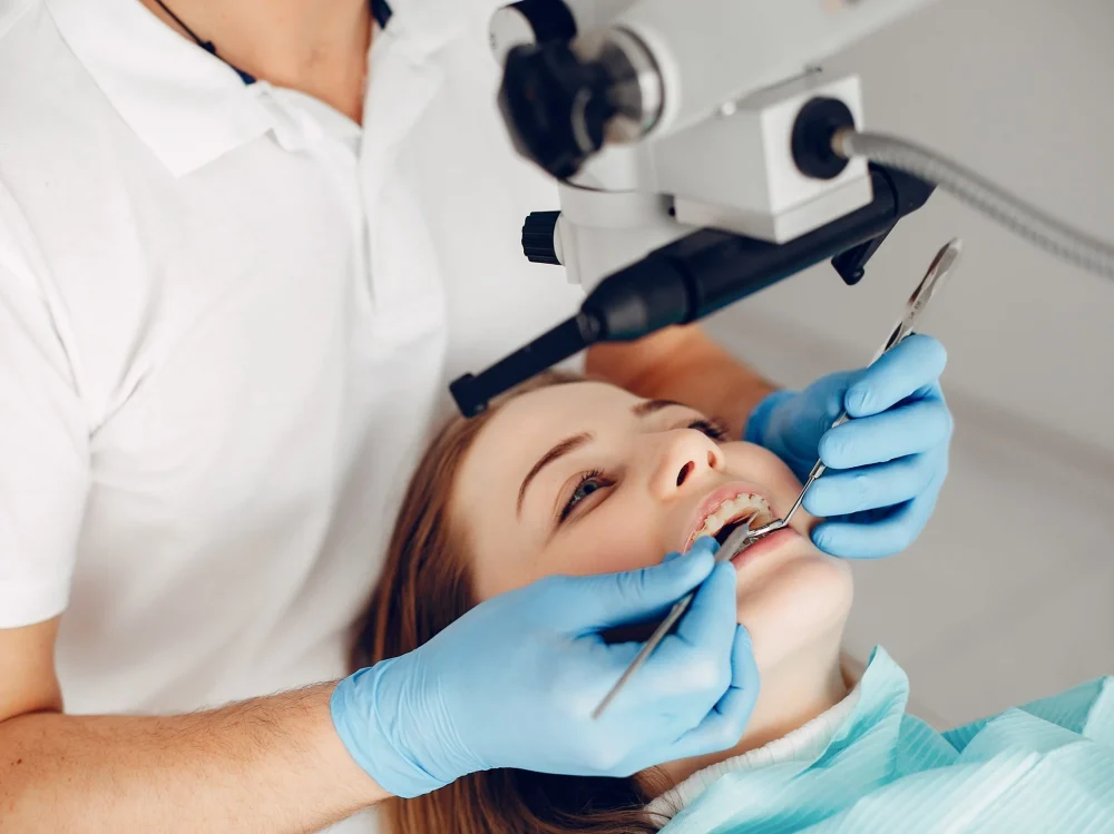 Beautiful lady in the dentist's office. Woman in a uniform